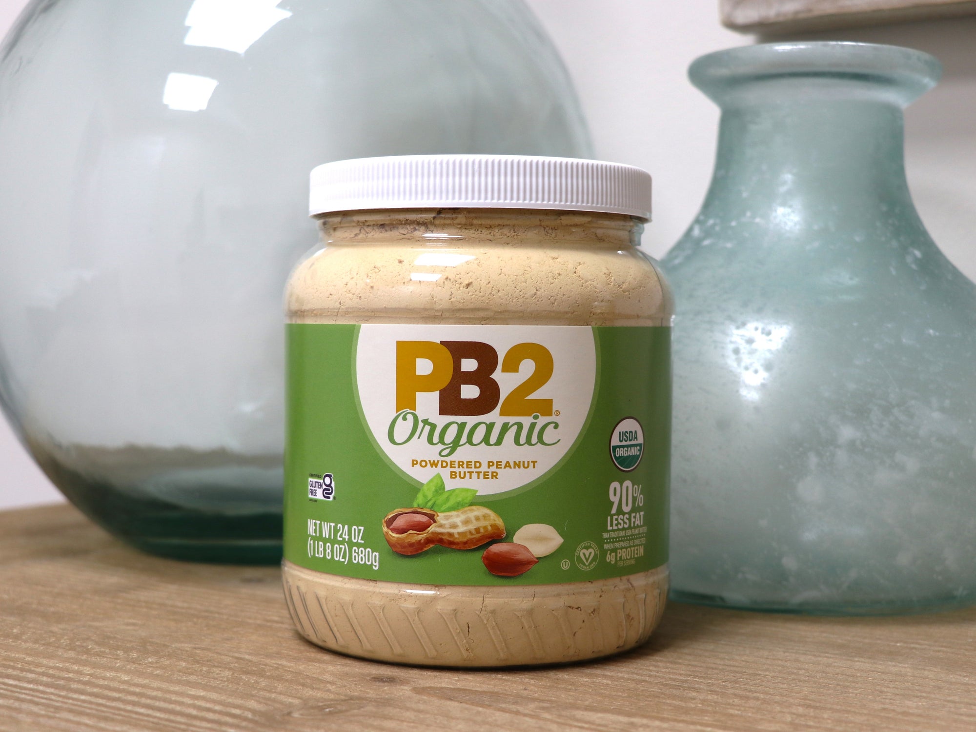 PB2 Organic Powdered Peanut Butter Jar sitting on tabletop. 